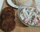 A picture of step 6 of Qeemay rice with shami kabab and vegetables salad.