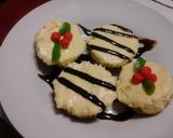 A picture of step 8 of No bake classic cheese cake with chocalate or christmas themed toppings.
