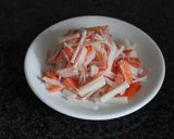 A picture of step 1 of Crab Stick and Artichoke Dip.