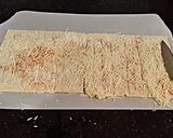 A picture of step 5 of Bacon Wrapped Cheese Breadsticks.