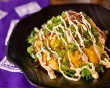 A picture of step 8 of Omu-Okonomiyaki (Japanese as-you-like pancake wrapped with egg).