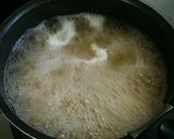 A picture of step 1 of Creamy Pasta with Wiener Sausages and Spinach.