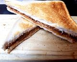 A picture of step 2 of My Peanut Butter & Cadbury,s Caramel Chocolate Toast Sandwich.😘.