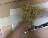 A picture of step 22 of Bright Yellow Turmeric Udon Noodles.