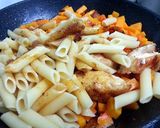 A picture of step 10 of Spicy Buttery Squash And Chicken With Penne.