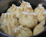 A picture of step 5 of Simmered Gomoku (Five-Ingredient) "Kinchaku" Pouches Stuffed with Tofu and Ground Chicken.