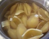 A picture of step 3 of Cheesy Chicken Alfredo stuffed shells.