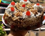 A picture of step 11 of Black forest cake stuff California crunchy walnuts cake.