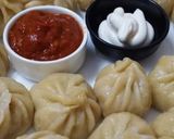 A picture of step 9 of Delicious Momos with red chutney.