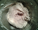 A picture of step 5 of White Butter Cake layered with Raspberry Cream with a White Chocolate Frosting.