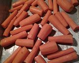 A picture of step 2 of Roasted Duck on a bed of carrots.