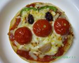 A picture of step 6 of English Muffin Anpanman Pizzas.