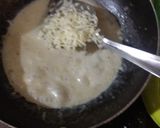 A picture of step 4 of Spinach roll in cheese sauce.