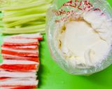 A picture of step 2 of Two types of rolls with crab sticks.