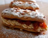 Foto del paso 7 de la receta Eclairs sin gluten de crema y albaricoque con chocolate blanco