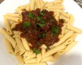 A picture of step 8 of Penne pasta with meat ball sauce.