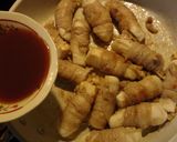 A picture of step 4 of Japanese-style Enoki Mushrooms and Hanpen Fish Cake Wrapped with Sliced Pork.