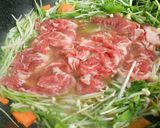 A picture of step 4 of Quick Simmered Shabu-Shabu Pork and Mizuna Greens.