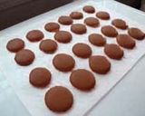 A picture of step 30 of Rich Bitter Chocolate Macarons.
