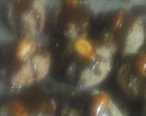 A picture of step 3 of Peanut butter coconut Christmas balls.