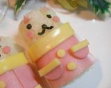 A picture of step 4 of Santa Barrel Cats Character Bento.