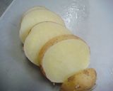 A picture of step 6 of New Potatoes and Pork with Rich Butter Soy Sauce.