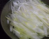 A picture of step 1 of Shabu-Shabu Hot Pot with Pork and Scallions, Served with Salt.