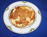 A picture of step 7 of Rice flour pancakes with frozen banana yogurt and strawberry sauce.