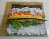 A picture of step 7 of Salad Roll (with rolling instructions).