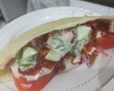 A picture of step 4 of Pita bread packet vegetable sandwich.
