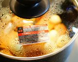 A picture of step 3 of Sweet and Salty Simmered Satsuma-Age and QuailEggs.