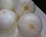 A picture of step 1 of Chinese Soup with Ground Chicken and a Whole Onion.