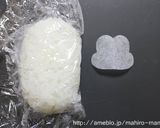 A picture of step 2 of Doll Festival Bento with Mickey and Minnie Onigiri.