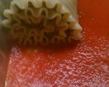 A picture of step 10 of Pesto Turkey Florentine Lasagna Roll Ups.