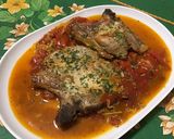 Une image de l'étape 12 de Côtes de porc aux tomates, ail rose et fanes de navets.
