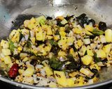A picture of step 2 of Daliya upma (Broken wheat upma).