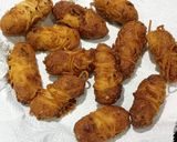 A picture of step 3 of Crispy Rava Nuggets Noddles Wrapped.