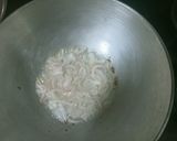 A picture of step 2 of Masala Corn Rice.