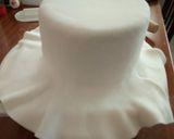 A picture of step 7 of Chocolate with ground nuts cake covered in fondant.