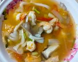 A picture of step 6 of Tom Yum Soup with Mushrooms and Shrimp.