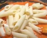 A picture of step 2 of Penne pasta with cheese.