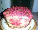 A picture of step 7 of 4 layer vanilla red cake.