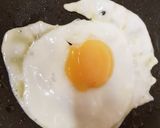 A picture of step 8 of Corned Beef Hash with a fried egg on top.