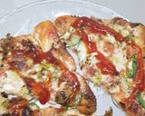 A picture of step 9 of Tawa bread pizza.