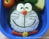 A picture of step 12 of Easy Charaben Doraemon with Nori Seaweed.