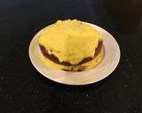 A picture of step 11 of Vanilla Layer Cake filled withLenon and Rasberry and frosted with Fresh Lemon Cream.