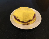 A picture of step 11 of Vanilla Layer Cake filled withLenon and Rasberry and frosted with Fresh Lemon Cream.