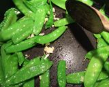 A picture of step 4 of Garlic Snow Peas With Lemon Zest and Parmesan.