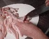 A picture of step 3 of Chicken Wing Gyoza (with chicken de-boning instructions).