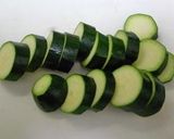 A picture of step 1 of Marinated Grilled Zucchini & Tomato Salad.